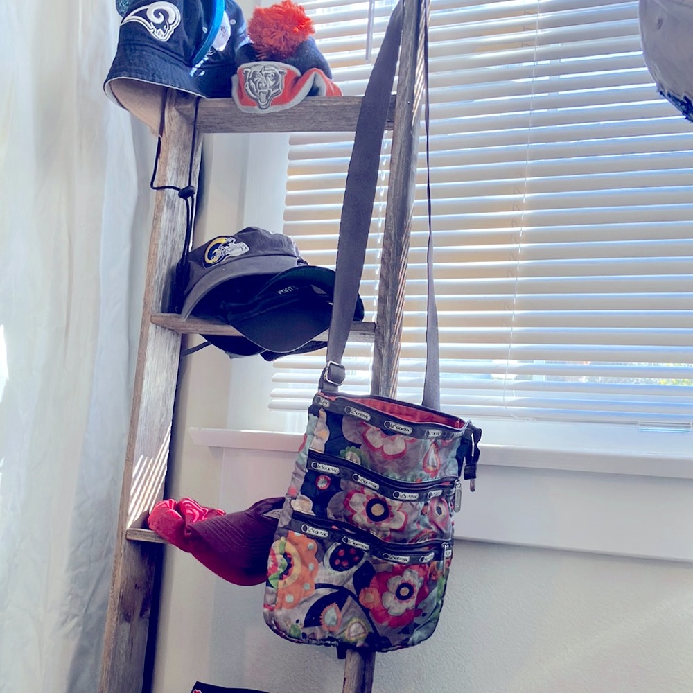 LeSportsac cross over Spring Flower 3 zipper purse.